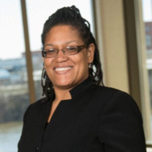 Koleta Moore, she/hers, poses for her professional headshot